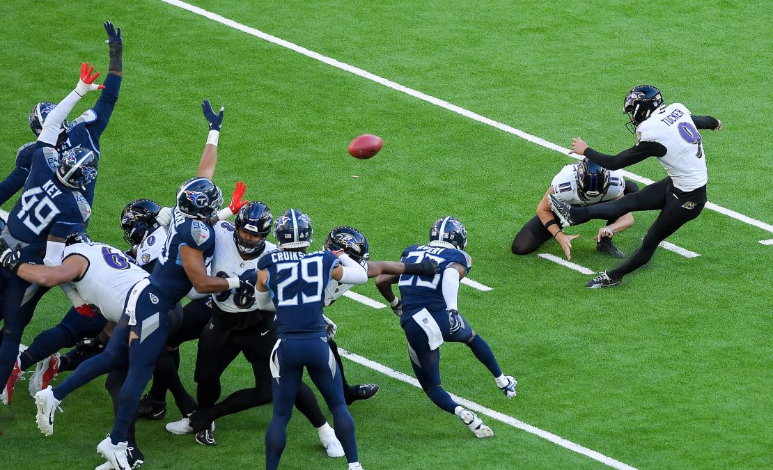 Justin Tucker of Baltimore Ravens controls the ball during the NFL match between Baltimore Ravens and Tennessee Titans at Tottenham Hotspur Stadium on October 15, 2023 in London, England.