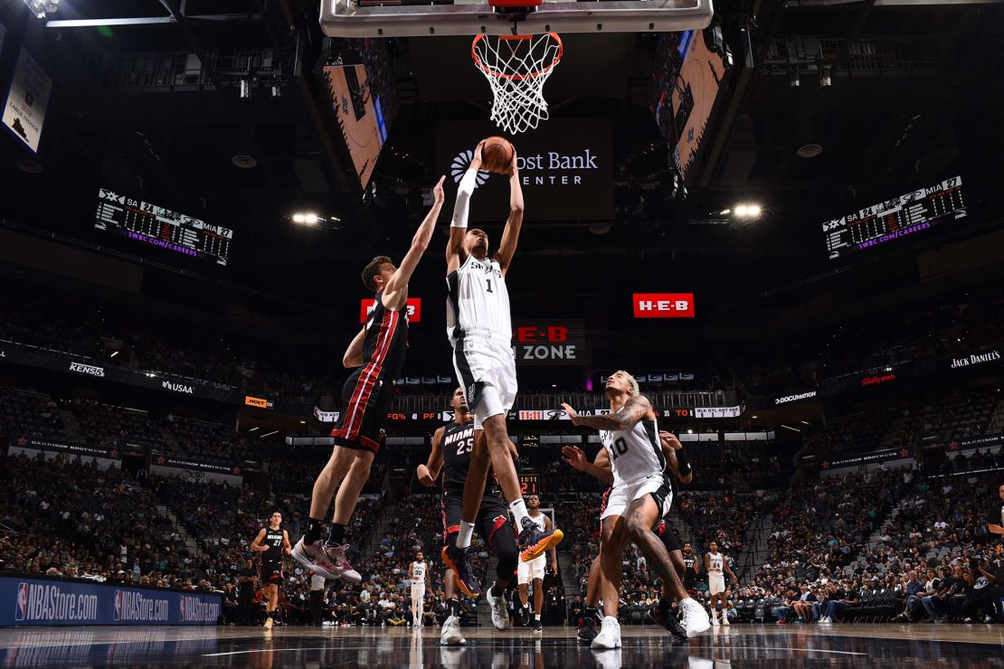 SAN ANTONIO, TX - OCTOBER 13: Victor Wembanyama #1 of the San Antonio Spurs dunks the ball during the game against the Miami Heat on October 13, 2023 at the Frost Bank Center in San Antonio, Texas. NOTE TO USER: User expressly acknowledges and agrees that, by downloading and/or using this Photograph, user is consenting to the terms and conditions of the Getty Images License Agreement. Mandatory Copyright Notice: Copyright 2023 NBAE (Photo by Garrett Ellwood/NBAE via Getty Images)