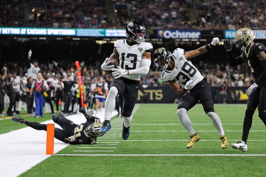 NEW ORLEANS, LOUISIANA - OCTOBER 19: Christian Kirk #13 of the Jacksonville Jaguars scores a 44-yard receiving touchdown during the fourth quarter against the New Orleans Saints at Caesars Superdome on October 19, 2023 in New Orleans, Louisiana. (Photo by Jonathan Bachman/Getty Images)