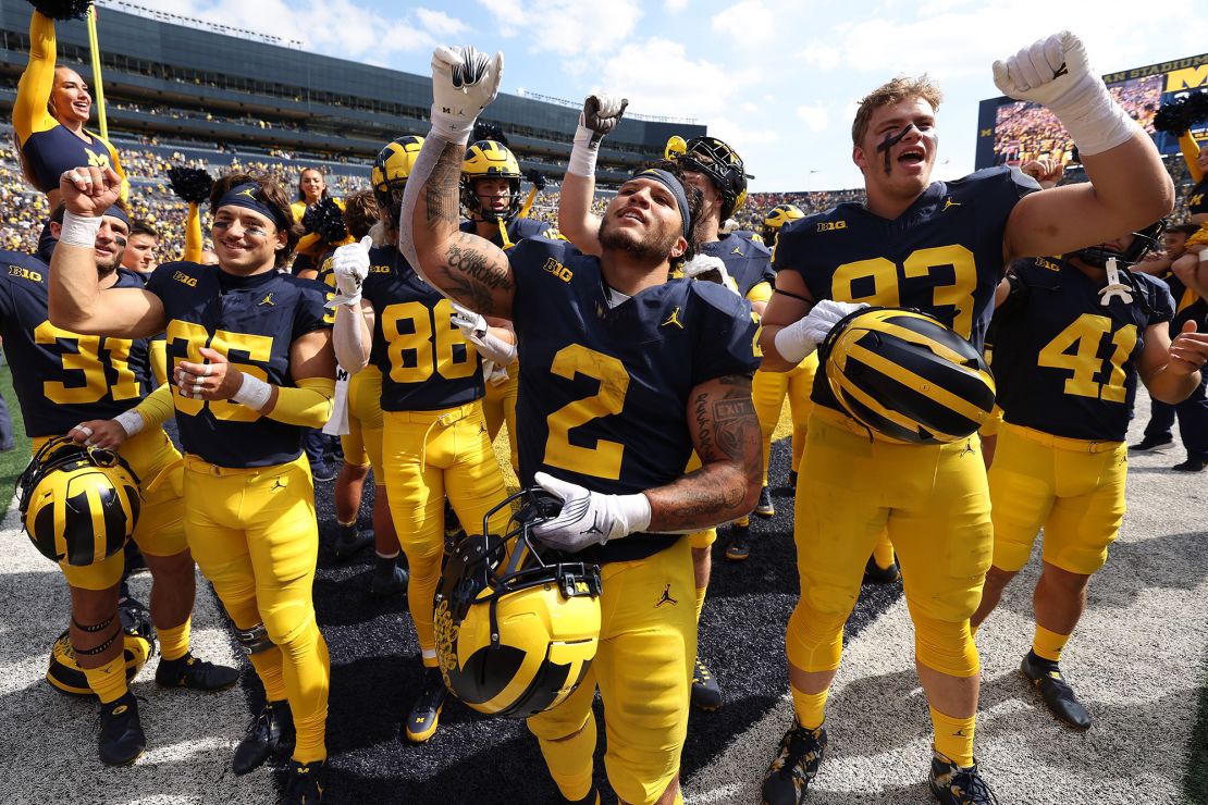 ANN ARBOR, MICHIGAN - SEPTEMBER 23: Blake Corum #2 of the Michigan Wolverines celebrates a 31-7 win over the Rutgers Scarlet Knights with teammates at Michigan Stadium on September 23, 2023 in Ann Arbor, Michigan. (Photo by Gregory Shamus/Getty Images)