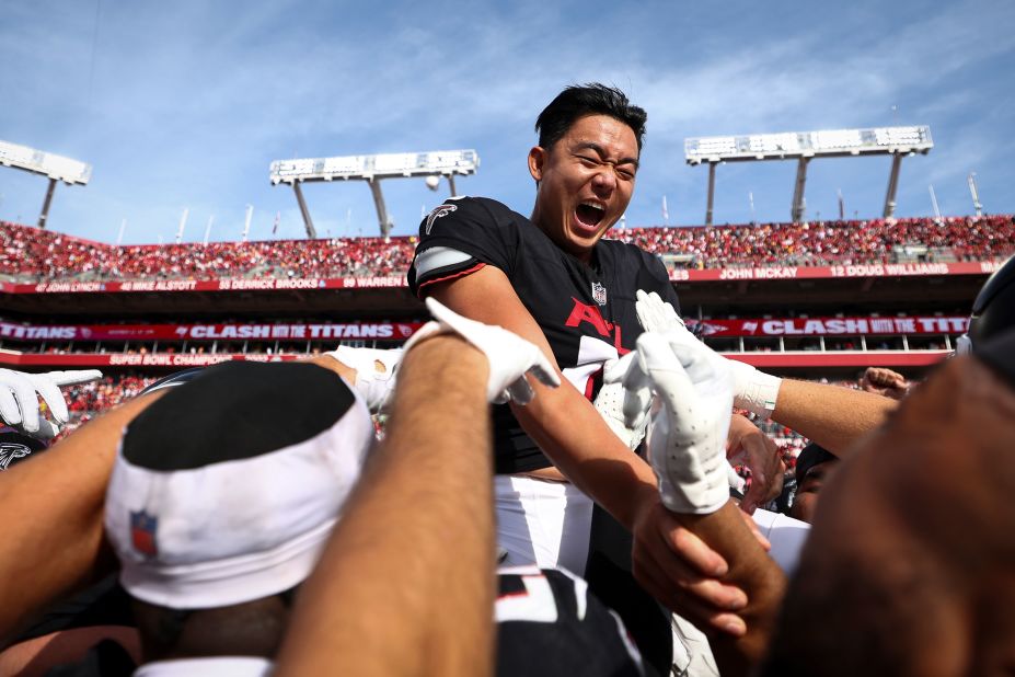 Atlanta Falcons placekicker Younghoe Koo celebrates with teammates after making a game-winning field goal on the final play of the Falcons' 16-13 victory over the Tampa Bay Buccaneers.