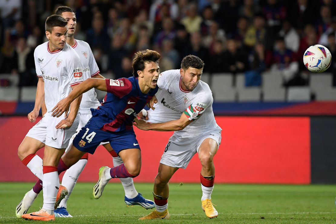 Barcelona's Portuguese forward #14 Joao Felix fights for the ball with Athletic Bilbao's Spanish defender #18 Oscar De Marcos during the Spanish league football match between FC Barcelona and Athletic Club Bilbao at the Estadi Olimpic Lluis Companys in Barcelona on October 22, 2023. (Photo by Josep LAGO / AFP) (Photo by JOSEP LAGO/AFP via Getty Images)