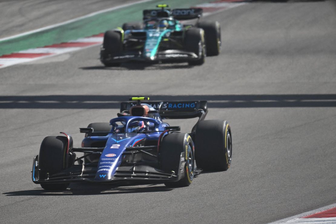 Williams' US driver Logan Sargeant is chased by Aston Martin's Spanish driver Fernando Alonso during the 2023 United States Formula One Grand Prix at the Circuit of the Americas in Austin, Texas, on October 22, 2023. (Photo by Jim WATSON / AFP) (Photo by JIM WATSON/AFP via Getty Images)