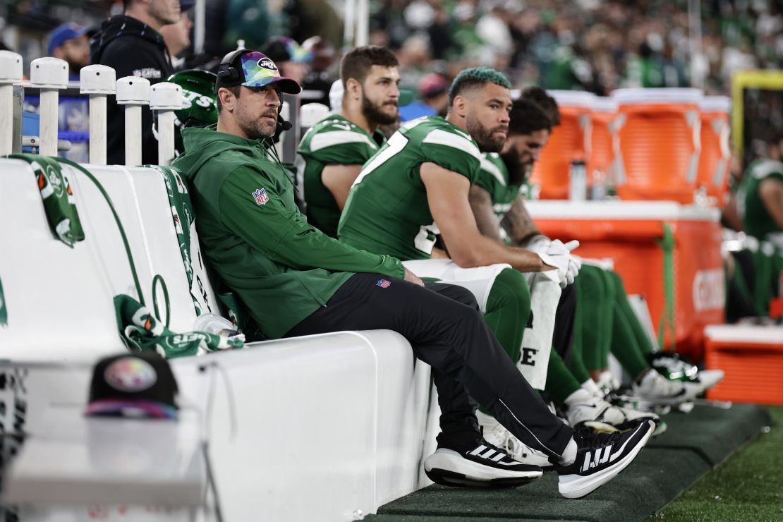 New York Jets quarterback Aaron Rodgers sits on the bench during the second half of an NFL football game against the Philadelphia Eagles, Sunday, Oct. 15, 2023, in East Rutherford, N.J. (AP Photo/Adam Hunger)