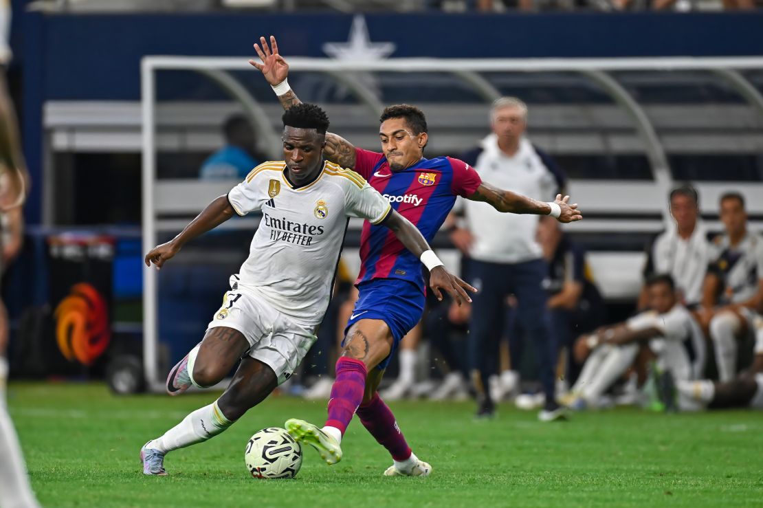 ARLINGTON, TX - JULY 29: Real Madrid forward, Vinicius Junior (7), and Barcelona forward, Raphinha (22), work for ball control during the International Men's Soccer match between Real Madrid and FC Barcelona on July 29, 2023; at AT&T Stadium in Arlington, TX. (Photo by Kevin Langley/Icon Sportswire via Getty Images)