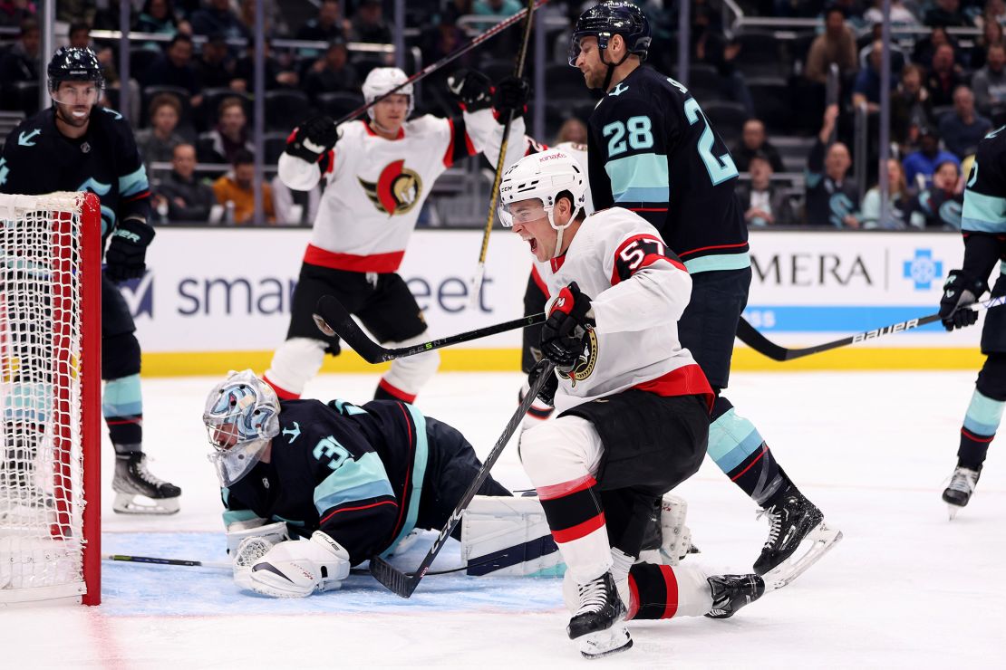 SEATTLE, WASHINGTON - MARCH 09: Shane Pinto #57 of the Ottawa Senators celebrates his goal against the Seattle Kraken during the first period at Climate Pledge Arena on March 09, 2023 in Seattle, Washington. (Photo by Steph Chambers/Getty Images)