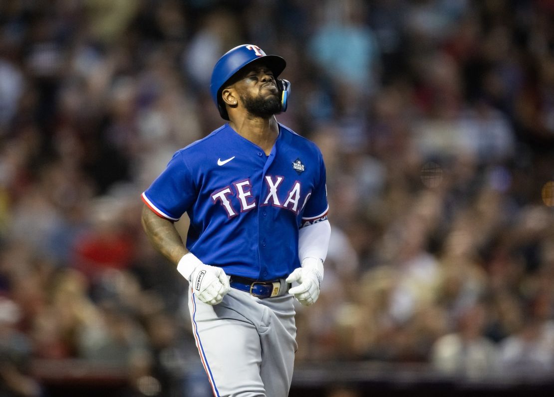 Oct 30, 2023; Phoenix, AZ, USA; Texas Rangers right fielder Adolis Garcia (53) reacts after after suffering an injury in the eighth inning of game three of the 2023 World Series against the Arizona Diamondbacks at Chase Field. Mandatory Credit: Mark J. Rebilas-USA TODAY Sports