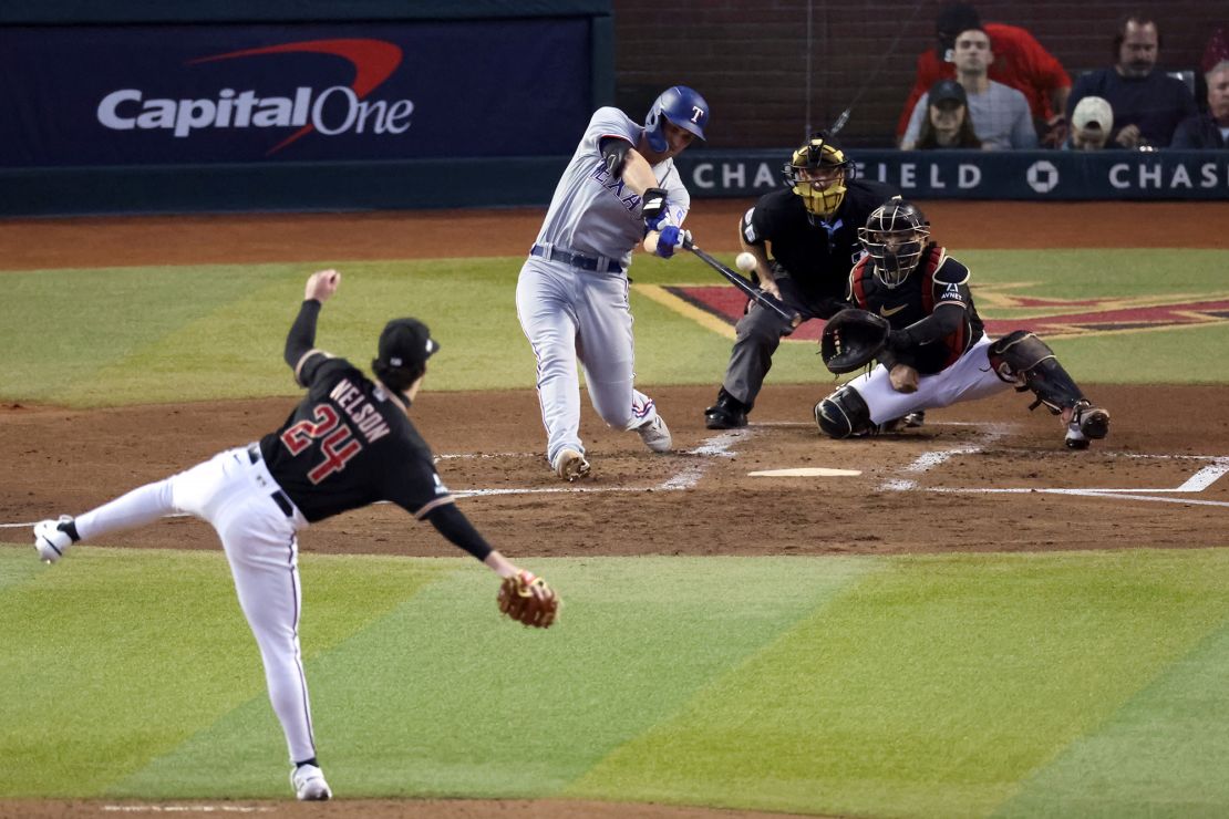 PHOENIX, ARIZONA - OCTOBER 31: Corey Seager #5 of the Texas Rangers hits a home run off Kyle Nelson #24 of the Arizona Diamondbacks in the second inning during Game Four of the World Series at Chase Field on October 31, 2023 in Phoenix, Arizona. (Photo by Sean M. Haffey/Getty Images)