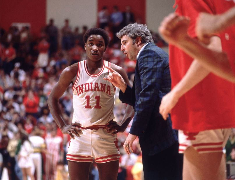 Knight talks to Indiana's Isiah Thomas on the sidelines during a game in 1981.