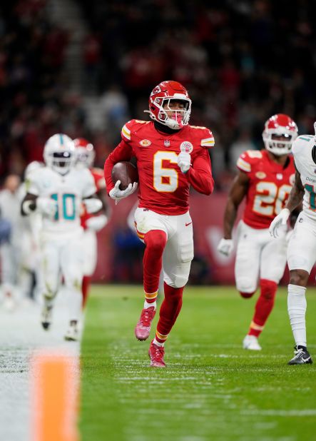 Kansas City Chiefs safety Bryan Cook returns a fumble by Miami Dolphins wide receiver Tyreek Hill for a touchdown.