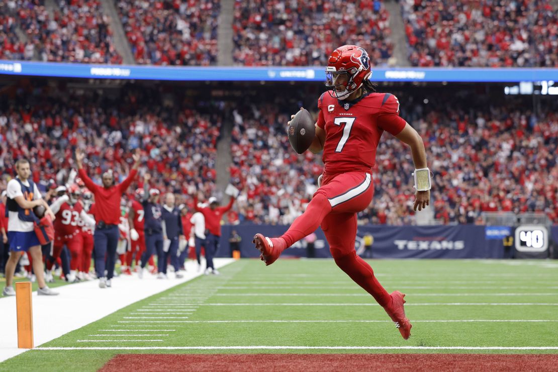 HOUSTON, TEXAS - NOVEMBER 26: C.J. Stroud #7 of the Houston Texans scores a rushing touchdown during the third quarter of a game against the Jacksonville Jaguars at NRG Stadium on November 26, 2023 in Houston, Texas. (Photo by Carmen Mandato/Getty Images)