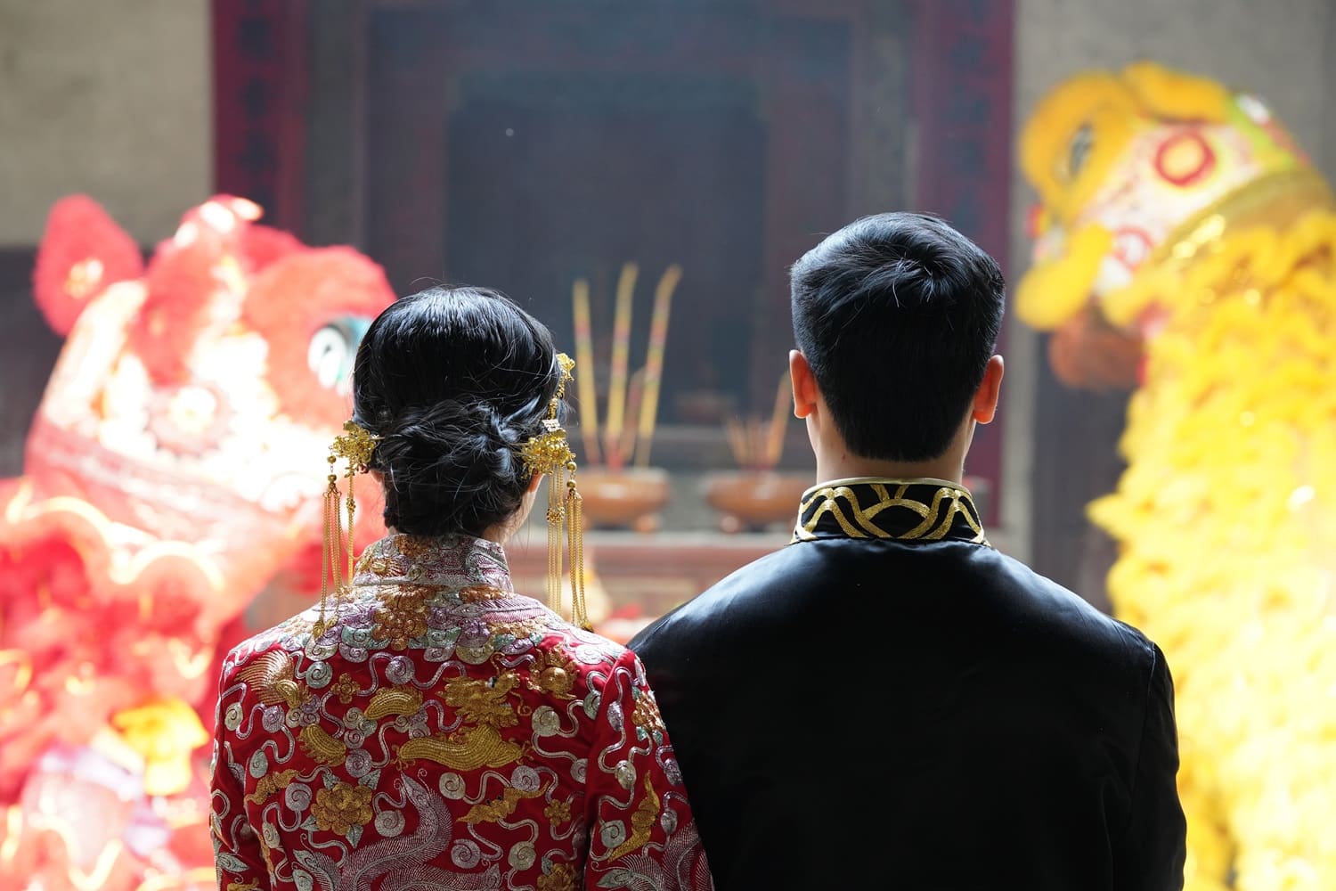 A couple at a traditional Chinese wedding.