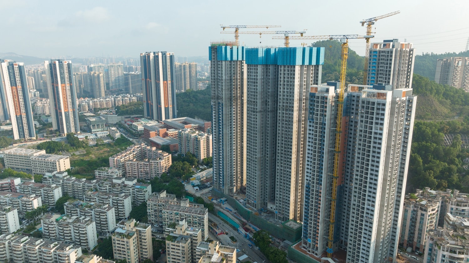 Cranes and high-rise residential buildings in Shenzhen, China.