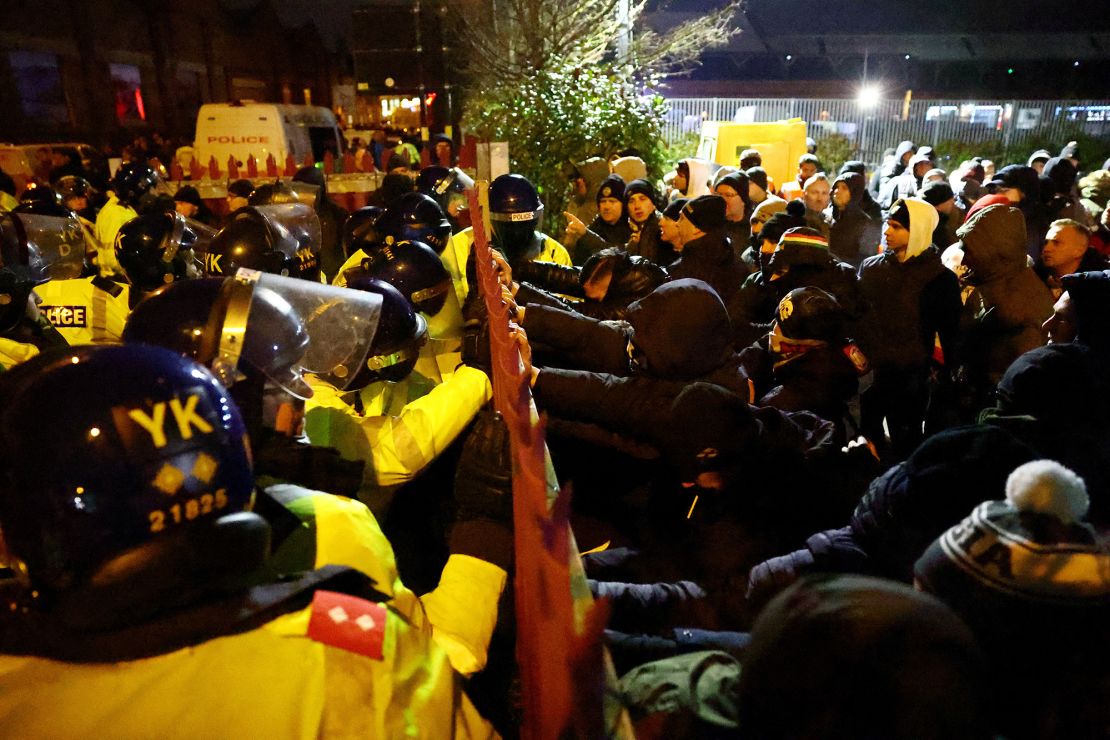 Legia Warsaw fans clash with police outside Villa Park in Birmingham.