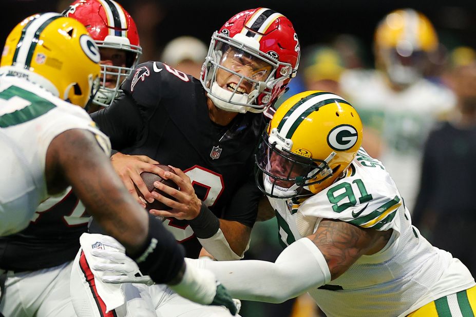 Atlanta Falcons quarterback Desmond Ridder is tackled by linebacker Preston Smith during the second half of a 25-24 win over the Green Bay Packers at Mercedes-Benz Stadium.