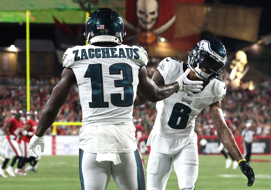 TAMPA, FLORIDA - SEPTEMBER 25: Olamide Zaccheaus #13 of the Philadelphia Eagles celebrates with DeVonta Smith #6 after a touchdown during the second quarter against the Tampa Bay Buccaneers at Raymond James Stadium on September 25, 2023 in Tampa, Florida. (Photo by Mike Carlson/Getty Images)