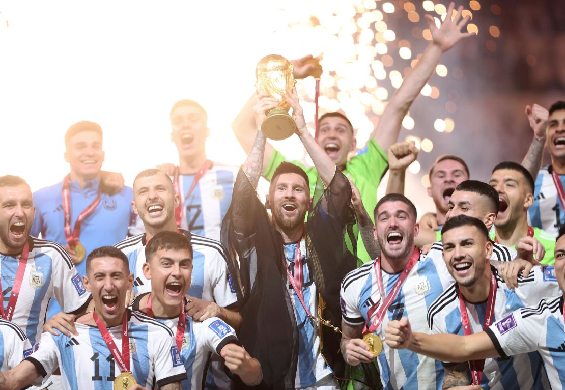 LUSAIL CITY, QATAR - DECEMBER 18: Lionel Messi of Argentina lifts the FIFA World Cup Qatar 2022 Winner's Trophy during the FIFA World Cup Qatar 2022 Final match between Argentina and France at Lusail Stadium on December 18, 2022 in Lusail City, Qatar. (Photo by Julian Finney/Getty Images)