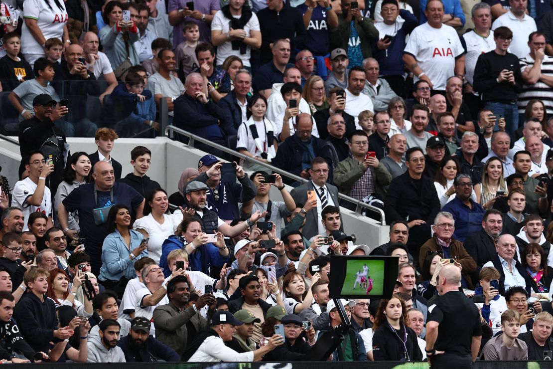 Referee Simon Hooper watches a VAR during the English Premier League football match between Tottenham Hotspur and Liverpool at Tottenham Hotspur Stadium in London, on September 30, 2023. (Photo by HENRY NICHOLLS / AFP) / RESTRICTED TO EDITORIAL USE. No use with unauthorized audio, video, data, fixture lists, club/league logos or 'live' services. Online in-match use limited to 120 images. An additional 40 images may be used in extra time. No video emulation. Social media in-match use limited to 120 images. An additional 40 images may be used in extra time. No use in betting publications, games or single club/league/player publications. /  (Photo by HENRY NICHOLLS/AFP via Getty Images)