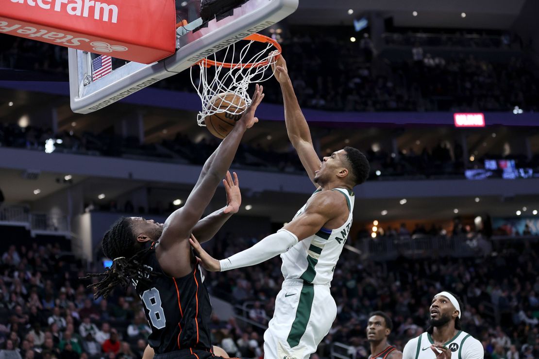 MILWAUKEE, WISCONSIN - NOVEMBER 08: Giannis Antetokounmpo #34 of the Milwaukee Bucks dunks over Isaiah Stewart #28 of the Detroit Pistons during the second half of a game at Fiserv Forum on November 08, 2023 in Milwaukee, Wisconsin. NOTE TO USER: User expressly acknowledges and agrees that, by downloading and or using this photograph, User is consenting to the terms and conditions of the Getty Images License Agreement. (Photo by Stacy Revere/Getty Images)