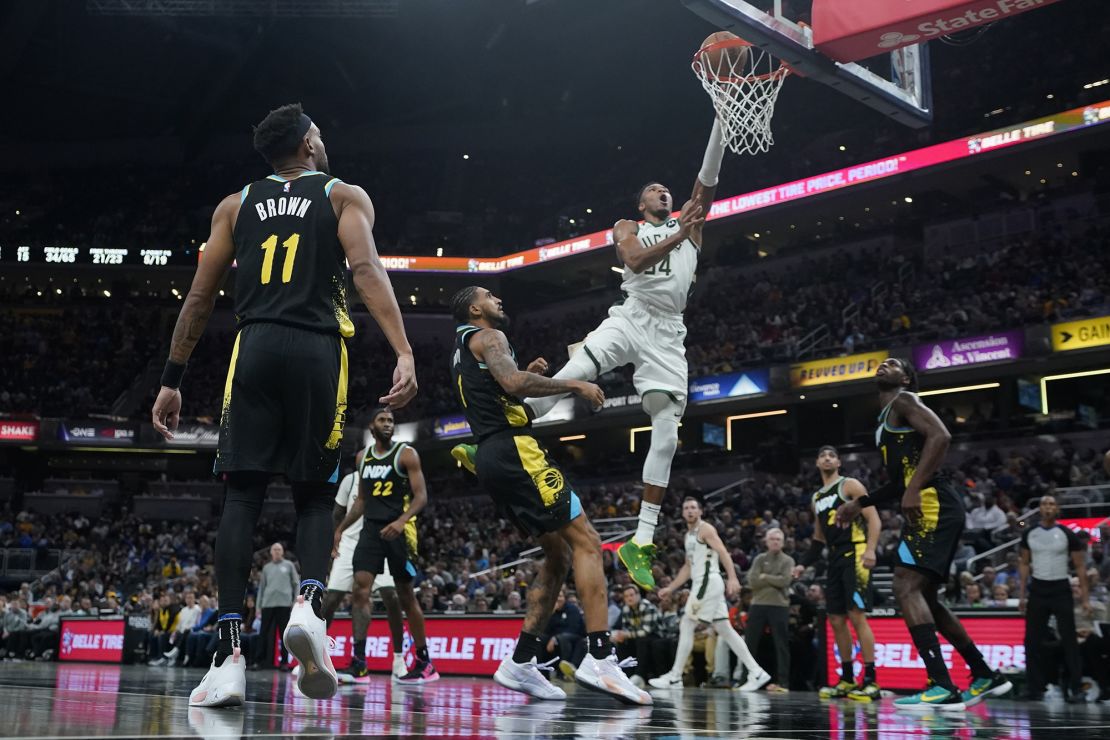 Milwaukee Bucks' Giannis Antetokounmpo (34) shoots against Indiana Pacers' Obi Toppin (1) during the second half of an NBA basketball game, Thursday, Nov. 9, 2023, in Indianapolis. (AP Photo/Darron Cummings)