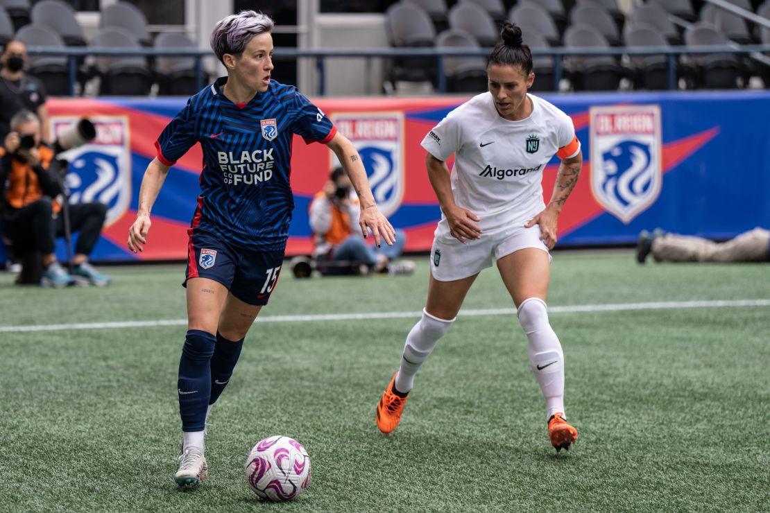 May 21, 2023; Seattle, Washington, USA; OL Reign forward Megan Rapinoe (15) dribbles the ball against NJ/NY Gotham FC defender Ali Krieger (11) at Lumen Field.