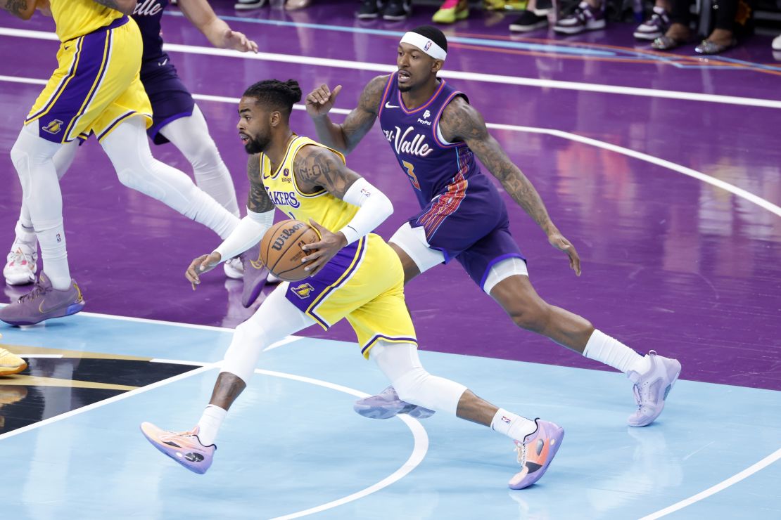 PHOENIX, ARIZONA - NOVEMBER 10: D'Angelo Russell #1 of the Los Angeles Lakers drives past Bradley Beal #3 of the Phoenix Suns during the first half of the NBA In-Season Tournament game at Footprint Center on November 10, 2023 in Phoenix, Arizona. NOTE TO USER: User expressly acknowledges and agrees that, by downloading and or using this photograph, User is consenting to the terms and conditions of the Getty Images License Agreement. (Photo by Chris Coduto/Getty Images)