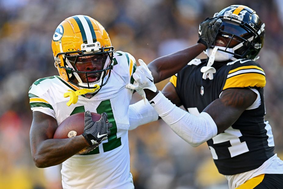 Green Bay Packers wide receiver Jayden Reed stiff arms Joey Porter Jr. of the Pittsburgh Steelers. The Steelers beat the Packers 23-19.