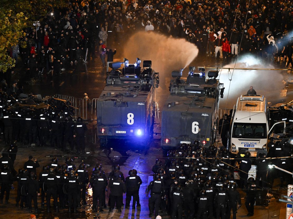 Police uses a water cannon towards protesters outside the Vassil Levski Stadium ahead of the UEFA Euro 2024 Group G qualification football match between Bulgaria and Hungary, at the Vassil Levski Stadium in Sofia, on November 16, 2023. At least five policemen and ten football fans were injured in clashes outside the stadium during Bulgaria's Euro 2024 qualifier against Hungary which ended in a 2-2 draw on Thursday, police said. Over 2,000 supporters gathered outside the national stadium shouting "Resign!" and holding banners "18 years is enough" to call for the resignation of long-time BFU president Borislav Mihaylov. (Photo by Nikolay DOYCHINOV / AFP) (Photo by NIKOLAY DOYCHINOV/AFP via Getty Images)