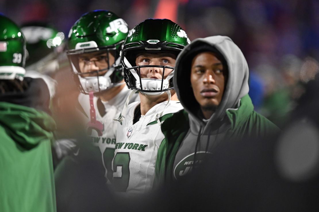 New York Jets quarterback Zach Wilson, center, stands on the sidelines after being pulled from the NFL football game against the Buffalo Bills during the second half in Orchard Park, N.Y., Sunday, Nov. 19, 2023. (AP Photo/Adrian Kraus)