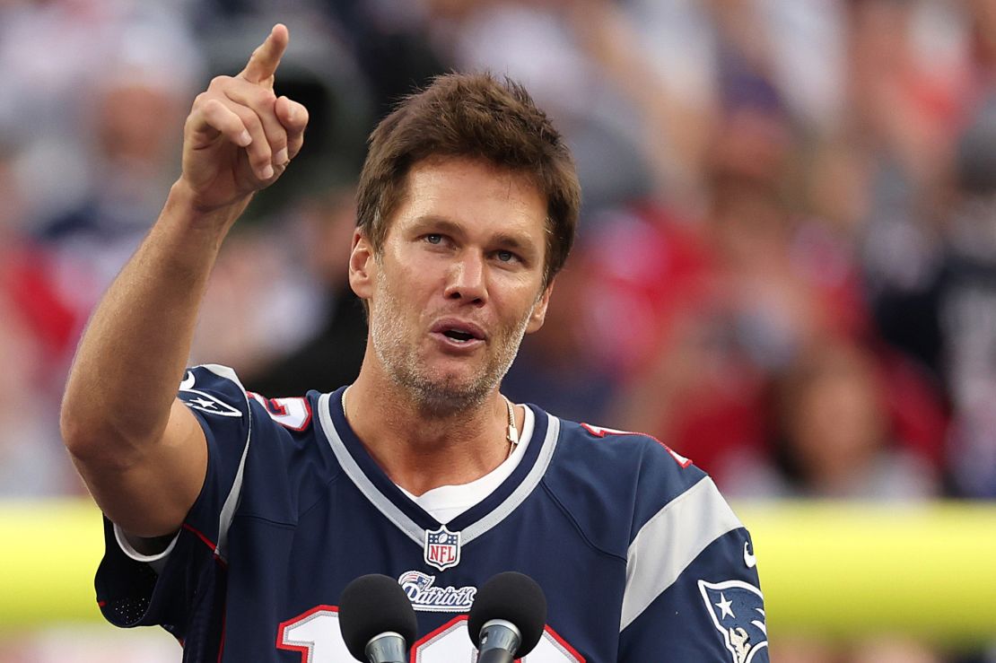 FOXBOROUGH, MASSACHUSETTS - SEPTEMBER 10: Former New England Patriots quarterback Tom Brady speaks during a ceremony honoring him at halftime of New England's game against the Philadelphia Eagles at Gillette Stadium on September 10, 2023 in Foxborough, Massachusetts. (Photo by Maddie Meyer/Getty Images)