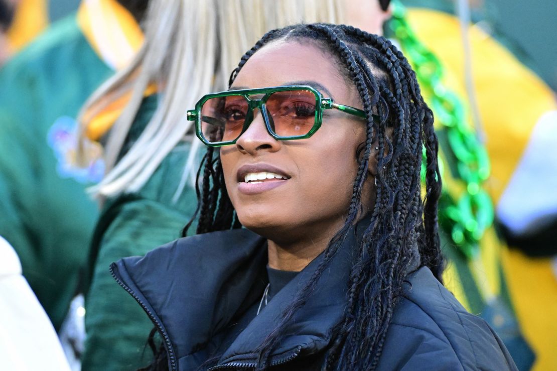 Nov 19, 2023; Green Bay, Wisconsin, USA; Olympic gymnast Simone Biles watches the Green Bay Packers warm up before game against the Los Angeles Chargers at Lambeau Field. Mandatory Credit: Benny Sieu-USA TODAY Sports