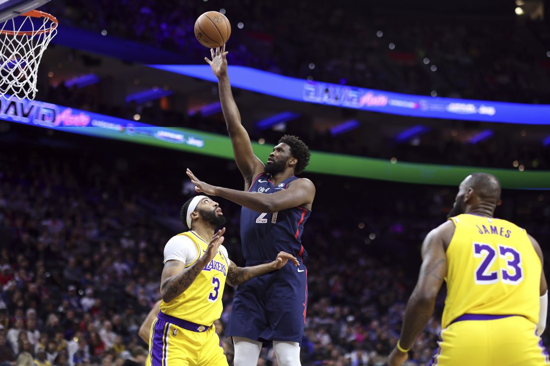 PHILADELPHIA, PENNSYLVANIA - NOVEMBER 27: Joel Embiid #21 of the Philadelphia 76ers shoots over Anthony Davis #3 of the Los Angeles Lakers during the first quarter at the Wells Fargo Center on November 27, 2023 in Philadelphia, Pennsylvania. NOTE TO USER: User expressly acknowledges and agrees that, by downloading and or using this photograph, User is consenting to the terms and conditions of the Getty Images License Agreement. (Photo by Tim Nwachukwu/Getty Images)