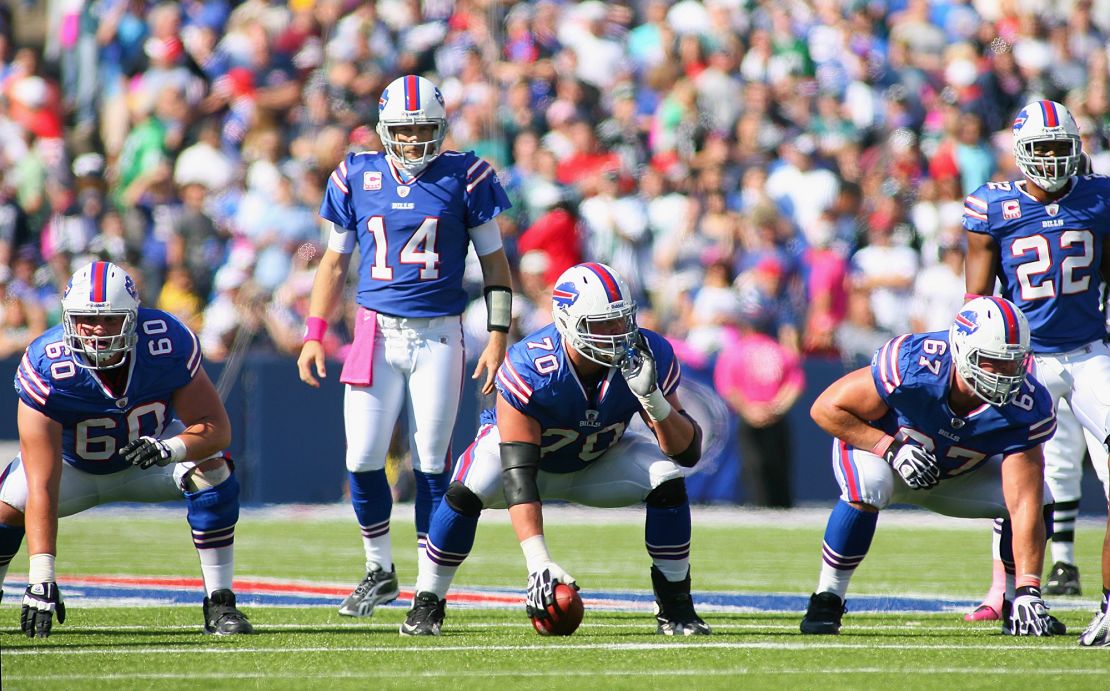 ORCHARD PARK, NY - OCTOBER 09:Ryan Fitzpatrick #14 of the Buffalo Bills linens up behind Kraig Urbik #60,Eric Wood #70 and Andy Levitre #67  against the Philadelphia Eagles  at Ralph Wilson Stadium on October 9, 2011 in Orchard Park, New York. Buffalo woin 31-24.  (Photo by Rick Stewart/Getty Images)