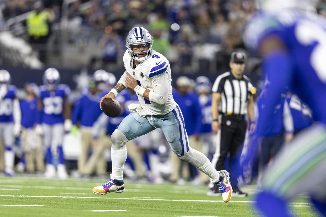 ARLINGTON, TEXAS - NOVEMBER 30: Dak Prescott #4 of the Dallas Cowboys scrambles and runs with the ball during an NFL football game between the Dallas Cowboys and the Seattle Seahawks at AT&T Stadium on November 30, 2023 in Arlington, Texas. (Photo by Michael Owens/Getty Images)