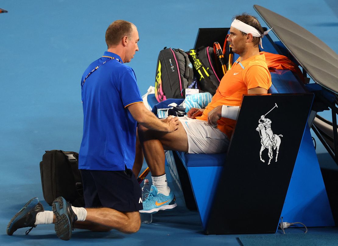 Tennis - Australian Open - Melbourne Park, Melbourne, Australia - January 18, 2023
Spain's Rafael Nadal receives medical attention after sustaining an injury during his second round match against Mackenzie Mcdonald of the U.S. REUTERS/Hannah Mckay