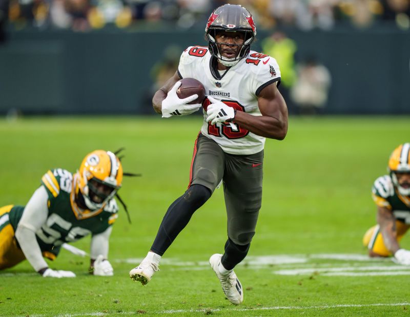 Tampa Bay Buccaneers wide receiver David Moore runs the ball 52 yards for a touchdown during the second half of the Buccaneers' 34-20 victory over the Green Bay Packers.