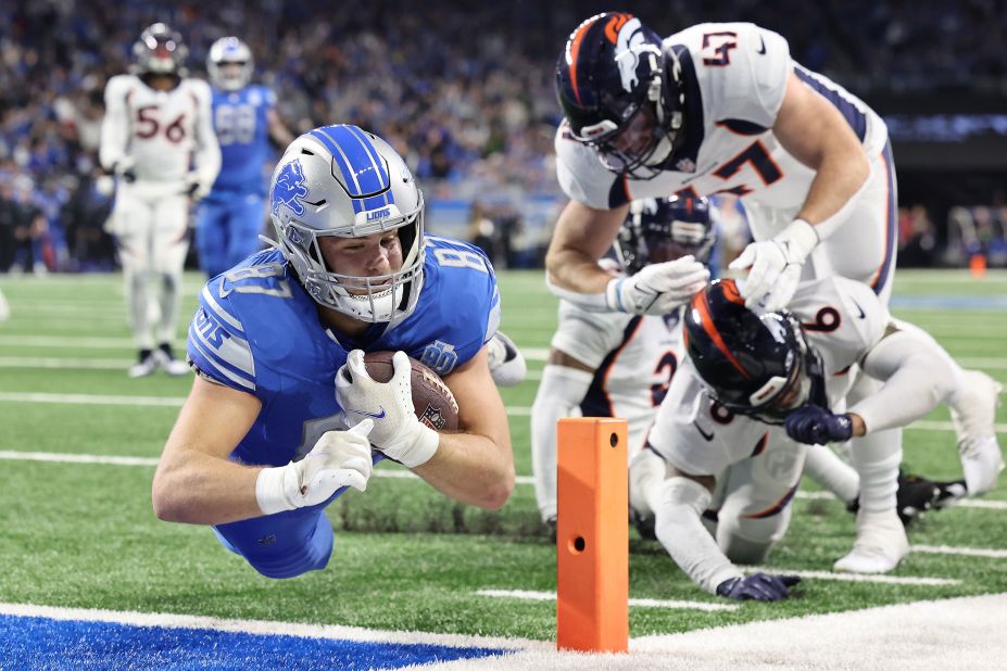 Detroit Lions tight end Sam LaPorta dives into the end zone for a touchdown on Saturday, December 16. The Lions beat the Denver Broncos 42-17.