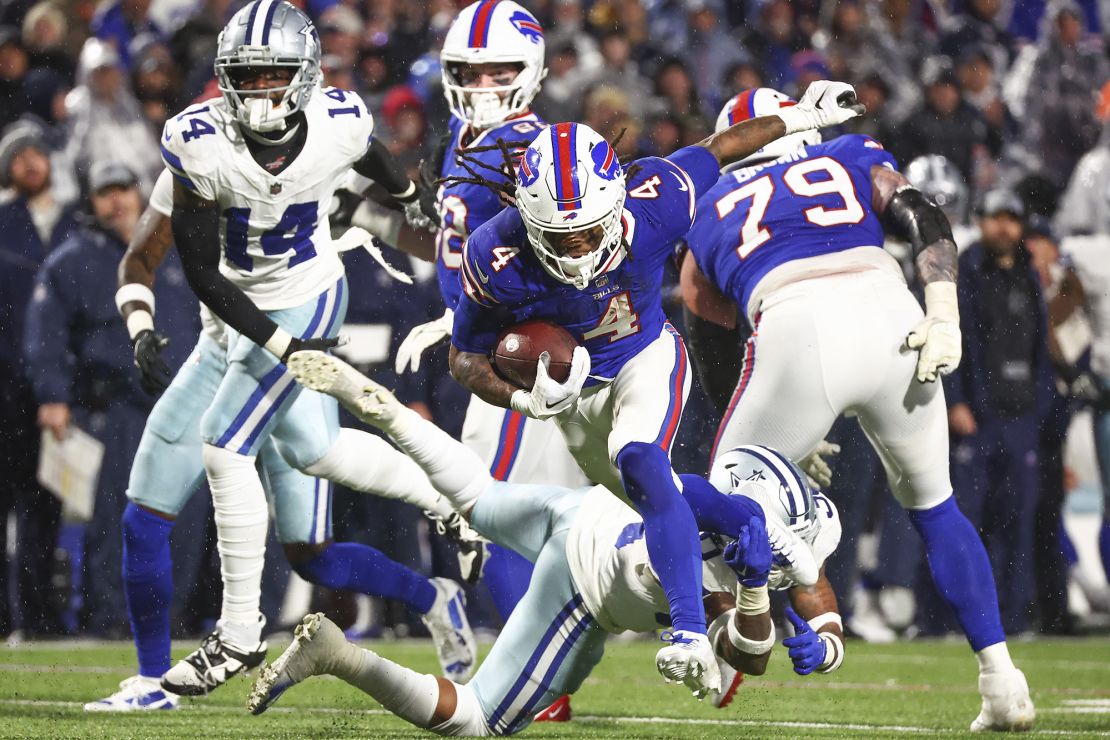 Buffalo Bills running back James Cook (4) runs for a touchdown against the Dallas Cowboys during the fourth quarter of an NFL football game, Sunday, Dec. 17, 2023, in Orchard Park, N.Y. (AP Photo/Jeffrey T. Barnes)