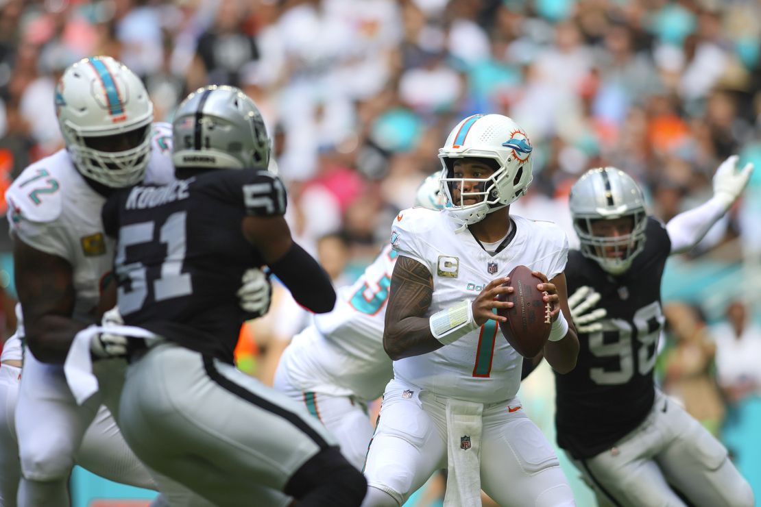 Nov 19, 2023; Miami Gardens, Florida, USA; Miami Dolphins quarterback Tua Tagovailoa (1) looks for a passing option against the Las Vegas Raiders during the first quarter at Hard Rock Stadium. Mandatory Credit: Sam Navarro-USA TODAY Sports