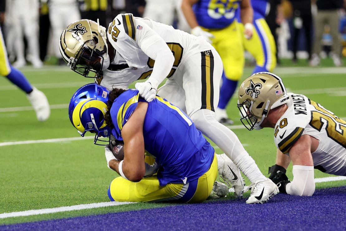 Puka Nacua #17 of the Los Angeles Rams scores a touchdown against Paulson Adebo #29 and Pete Werner #20 of the New Orleans Saints during the first quarter of the game at SoFi Stadium on December 21, 2023 in Inglewood, California.