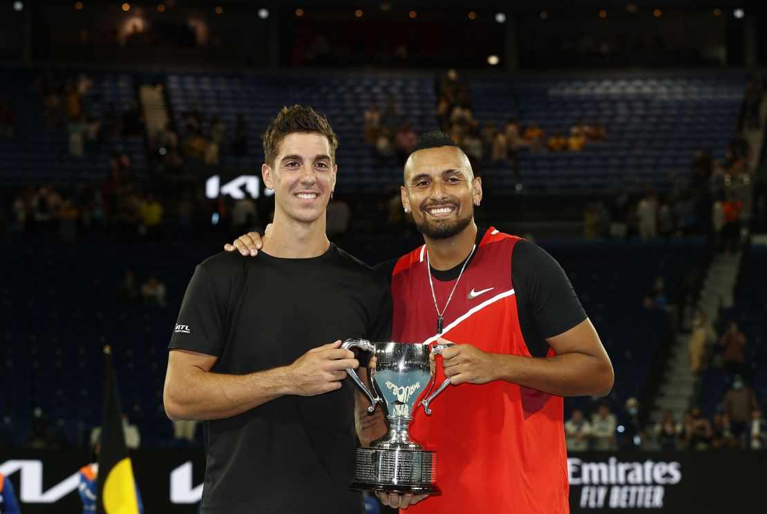 MELBOURNE, AUSTRALIA - JANUARY 29: Thanasi Kokkinakis (L) of Australia and Nick Kyrgios of Australia pose with the championship trophy after winning their Men's Doubles Final match against Matthew Ebden of Australia and Max Purcell of Australia during day 13 of the 2022 Australian Open at Melbourne Park on January 29, 2022 in Melbourne, Australia. (Photo by Darrian Traynor/Getty Images)