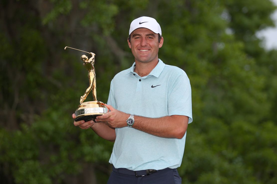 PONTE VEDRA BEACH, FLORIDA - MARCH 12: Scottie Scheffler of the United States celebrates with the trophy after winning during the final round of THE PLAYERS Championship on THE PLAYERS Stadium Course at TPC Sawgrass on March 12, 2023 in Ponte Vedra Beach, Florida. (Photo by Richard Heathcote/Getty Images)