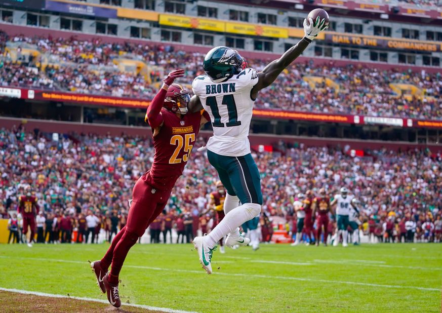 Philadelphia Eagles wide receiver A.J. Brown makes a one-handed catch to score a touchdown against Washington Commanders cornerback Benjamin St-Juste on October 29. The Eagles beat the Commanders 38-31.