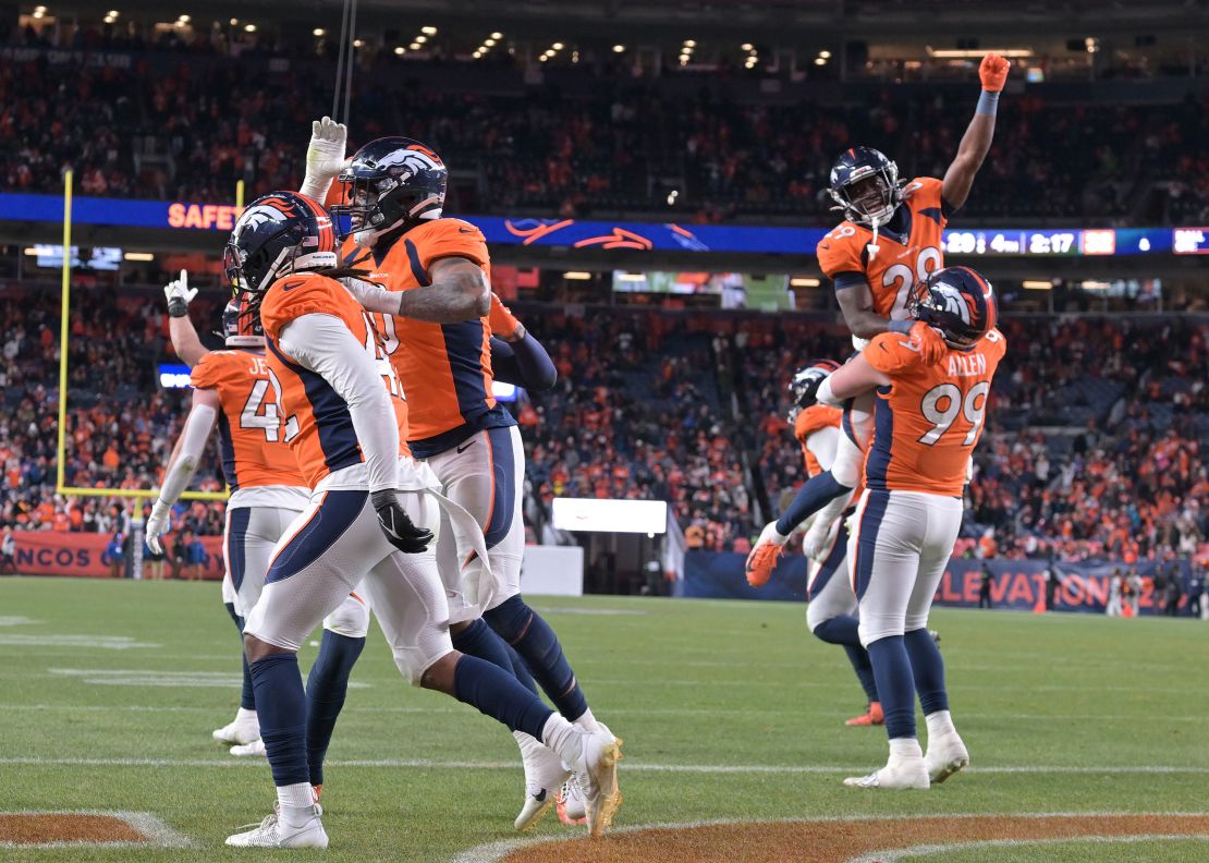 DENVER, COLORADO - NOVEMBER 26: Members of the Denver Broncos defense celebrates after a safety late in the game at Empower Field at Mile High on November 26, 2023 in Denver, Colorado. The Denver Broncos beat the Cleveland Browns 29-12 during week 12 of the NFL season. (Photo by  RJ Sangosti/MediaNews Group/The Denver Post via Getty Images)