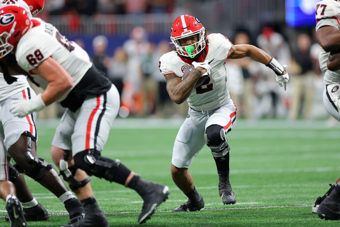 ATLANTA, GEORGIA - DECEMBER 02: Kendall Milton #2 of the Georgia Bulldogs rushes for a touchdown during the first quarter against the Alabama Crimson Tide in the SEC Championship at Mercedes-Benz Stadium on December 02, 2023 in Atlanta, Georgia. (Photo by Kevin C. Cox/Getty Images)