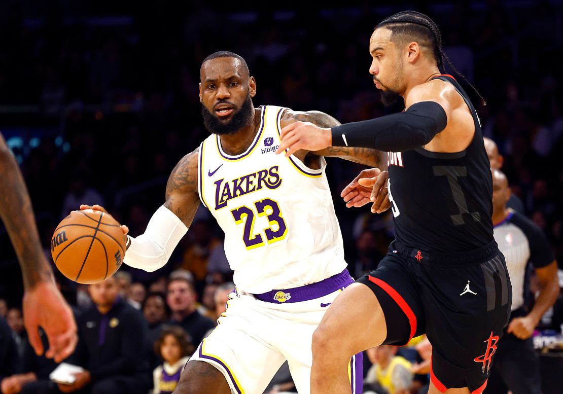 LeBron James #23 of the Los Angeles Lakers controls the ball against Dillon Brooks #9 of the Houston Rockets in the first quarter at Crypto.com Arena on December 02, 2023 in Los Angeles, California.