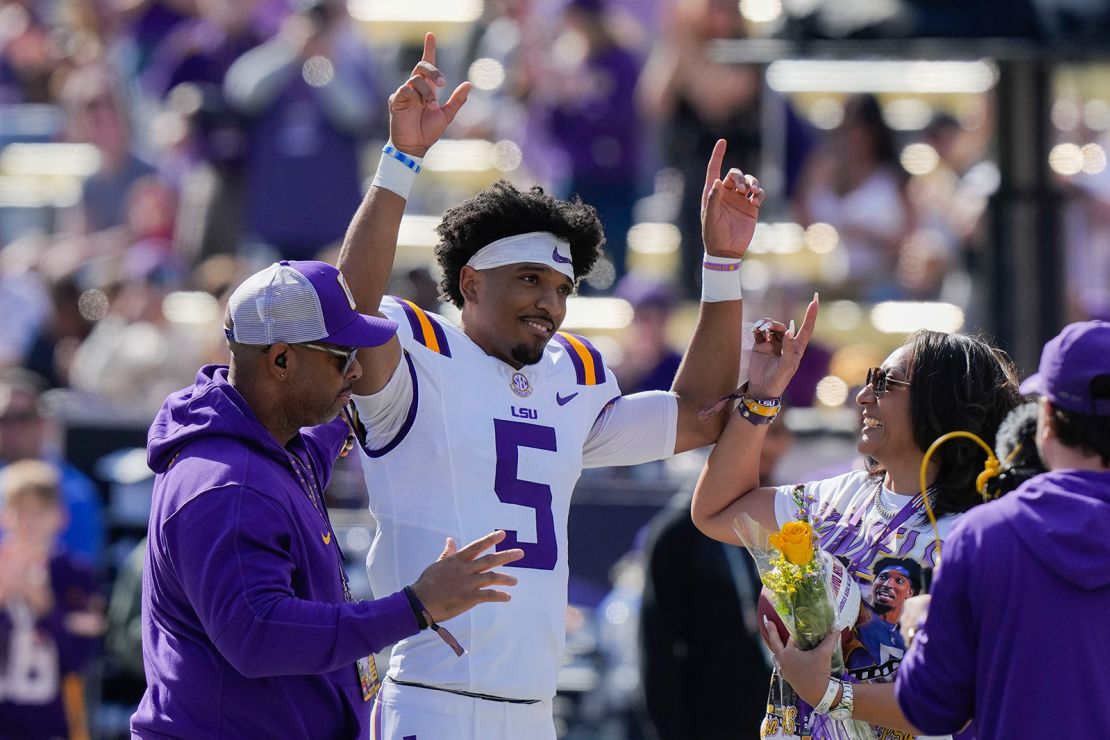 LSU quarterback Jayden Daniels (5) celebrates with his parents on senior day, for his final home game, before an NCAA college football game against Texas A&M in Baton Rouge, La., Saturday, November 25, 2023.