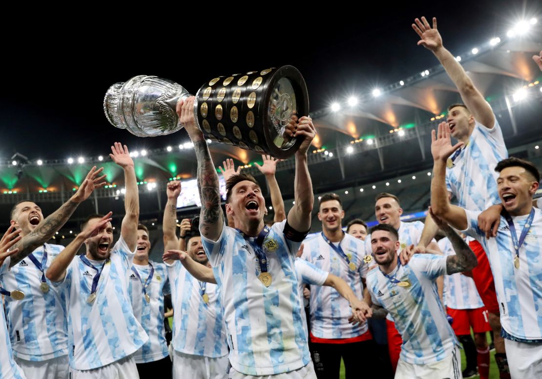 Soccer Football - Copa America  2021 - Final - Brazil v Argentina - Estadio Maracana, Rio de Janeiro, Brazil - July 10, 2021 Argentina's Lionel Messi and teammates celebrate winning the Copa America with the trophy REUTERS/Amanda Perobelli/File Photo     TPX IMAGES OF THE DAY SEARCH "POY SPORTS" FOR THIS STORY. SEARCH "REUTERS POY" FOR ALL BEST OF 2021 PACKAGES