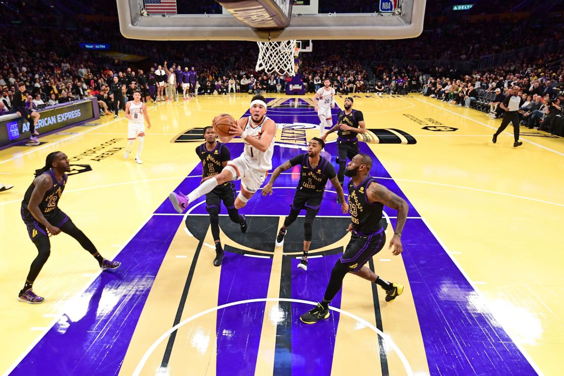 LOS ANGELES, CA - DECEMBER 5: Devin Booker #1 of the Phoenix Suns drives to the basket during the game against the Los Angeles Lakers during the Quarterfinals of the In-Season Tournament on December 5, 2023 at Crypto.Com Arena in Los Angeles, California. NOTE TO USER: User expressly acknowledges and agrees that, by downloading and/or using this Photograph, user is consenting to the terms and conditions of the Getty Images License Agreement. Mandatory Copyright Notice: Copyright 2023 NBAE (Photo by Adam Pantozzi/NBAE via Getty Images)