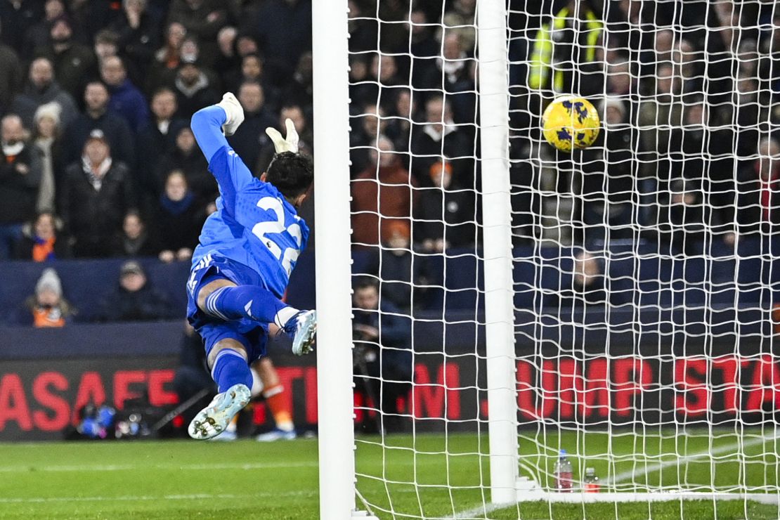 Arsenal's Spanish goalkeeper #22 David Raya misses to stop the goal scored by Luton Town's English defender #02 Gabriel Osho during the English Premier League football match between Luton Town and Arsenal at Kenilworth Road in Luton, north of London on December 5, 2023. (Photo by JUSTIN TALLIS / AFP) / RESTRICTED TO EDITORIAL USE. No use with unauthorized audio, video, data, fixture lists, club/league logos or 'live' services. Online in-match use limited to 120 images. An additional 40 images may be used in extra time. No video emulation. Social media in-match use limited to 120 images. An additional 40 images may be used in extra time. No use in betting publications, games or single club/league/player publications. /  (Photo by JUSTIN TALLIS/AFP via Getty Images)